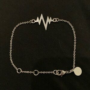 Lightening Bolt Bracelet integrated on delicate silver tone chain - 7.25”